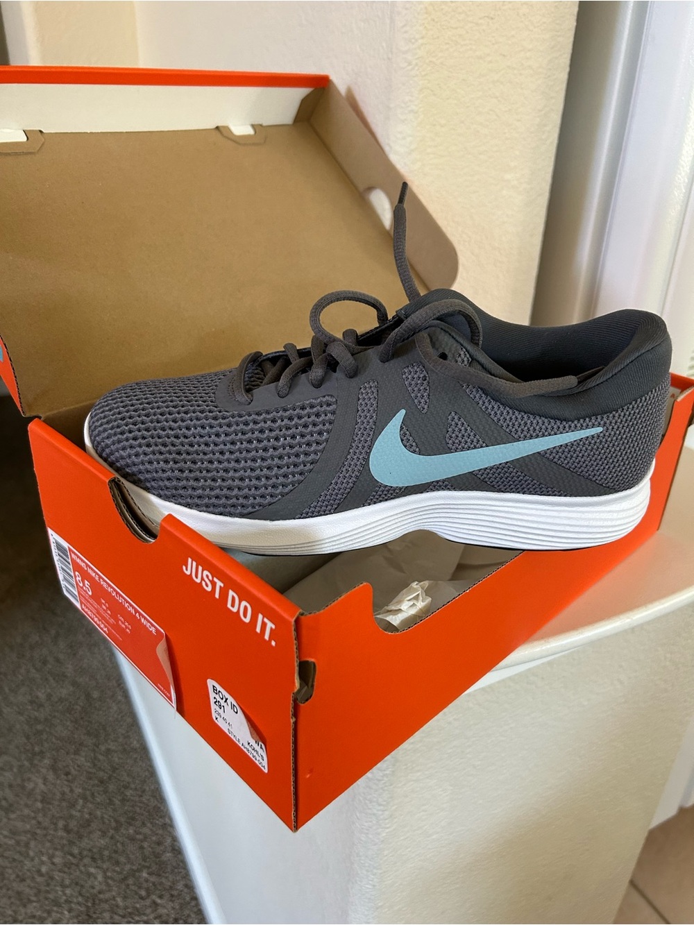 Nike Revolution 4 Women’s Gray Athletic Shoes with Light Blue Swoosh